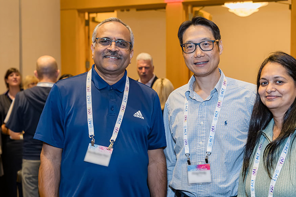 Attendee smiling at the camera