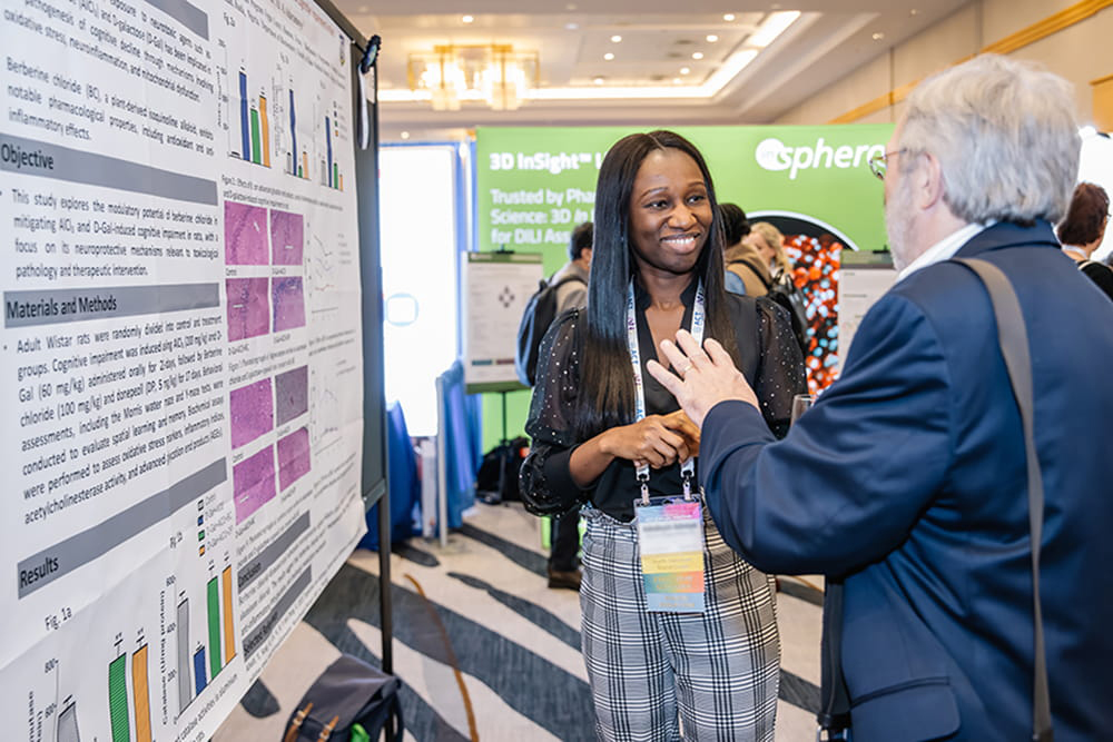 2 Attendee looking at a poster